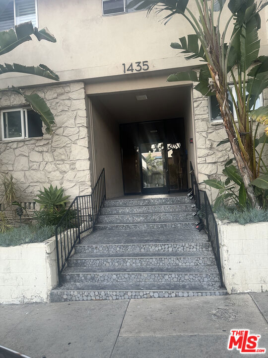 Tucked away in one of West Hollywood's most desirable pockets, this bright and beautifully upgraded 1-bedroom, 1-bath condo offers the perfect mix of style, comfort, and privacy. Perched on the top floor with no one above you, and privately located at the back of the building, this quiet retreat is bathed in natural light through large double-pane windows, complemented by wooden shutters and magnetic blinds for flexible ambiance.Step into a modern kitchen featuring rich wood cabinetry, elegant quartz countertops, and brand new LG stainless steel appliances perfect for both cooking and entertaining. The spa-like bathroom boasts a state-of-the-art shower with body jets, offering a luxurious start and end to your day.The bedroom is serene and functional, with a ceiling fan and a custom closet featuring beveled glass sliding doors. Stay comfortable year-round with a twin-duct A/C and heating system, and enjoy peace of mind with a secure 1-car garage, building-wide security cameras, and an upgraded intercom system.