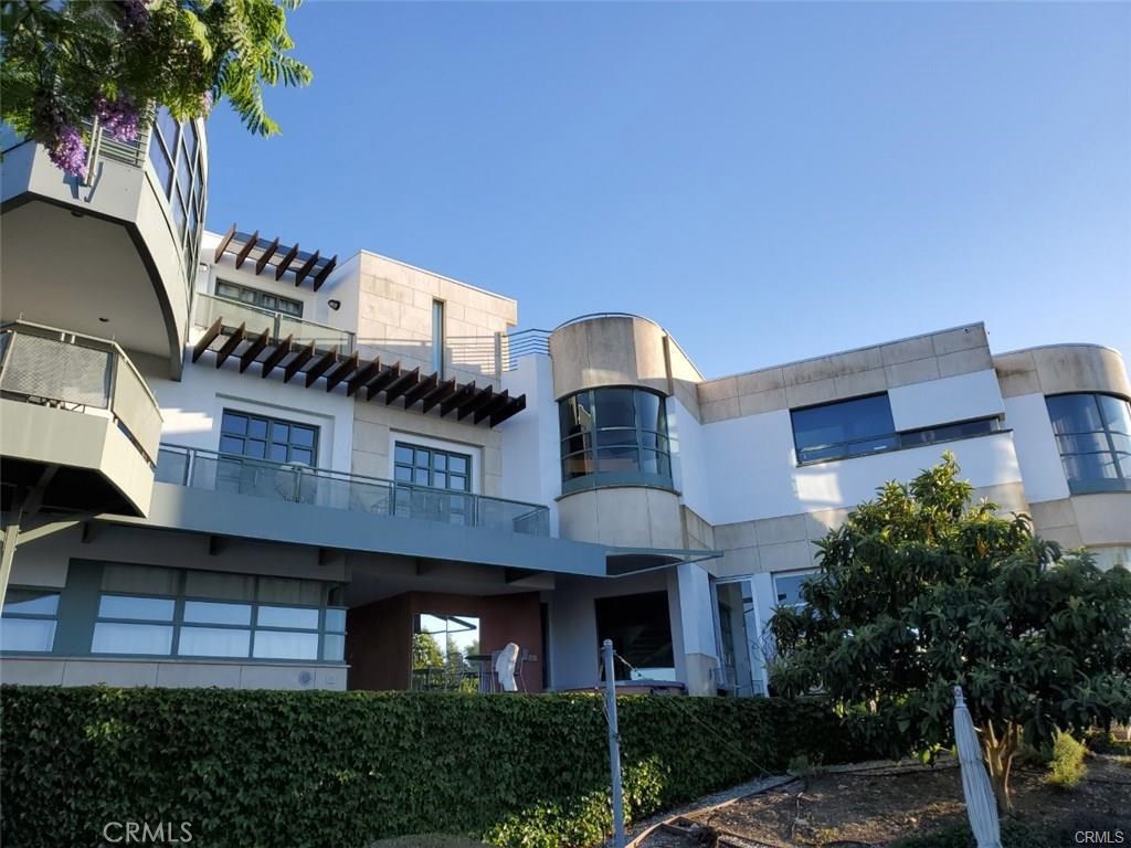 The Summit! A stunning, one of a kind Architectural pinnacle, above cloud level with panoramic ocean and city view of Malibu, Santa Monica, Hollywood (SIGN), downtown LA, San Gabriel Valley, Big Bear mountain, San Pedro and Long Beach shore. (Approximately 8533square feet Hillside Home on three levels (Approx. 7315 Main House + 540 SF enclosed Gym with Sauna + 678 SF Guest House) Designed by Ghanaian-born, world renowned International Architect, Joe Osae-Addo. Minutes to ocean, Trump National Golf Course & Terranea Resort. Freeway close, and close to LAX. Featuring elevator, guest house, annex, office, 6 zone HVAC, wine cellar, gym sauna, pool, whirlpool jacuzzi, European kitchen appliances & cabinets, subzeros, security system, 4 fireplaces, 3 wet bars, custom skylights, dry aquarium, sun deck, fruit orchard, and the list goes on. This house is built from street to street with access to the main and guest house from two different streets. Featured in LA Times, New York Times, and Spaces magazine. Great home to showcase and entertain.
Pictures of the night lights and the sunset over the Santa Monica and Malibu coast line are from the master balcony patio.