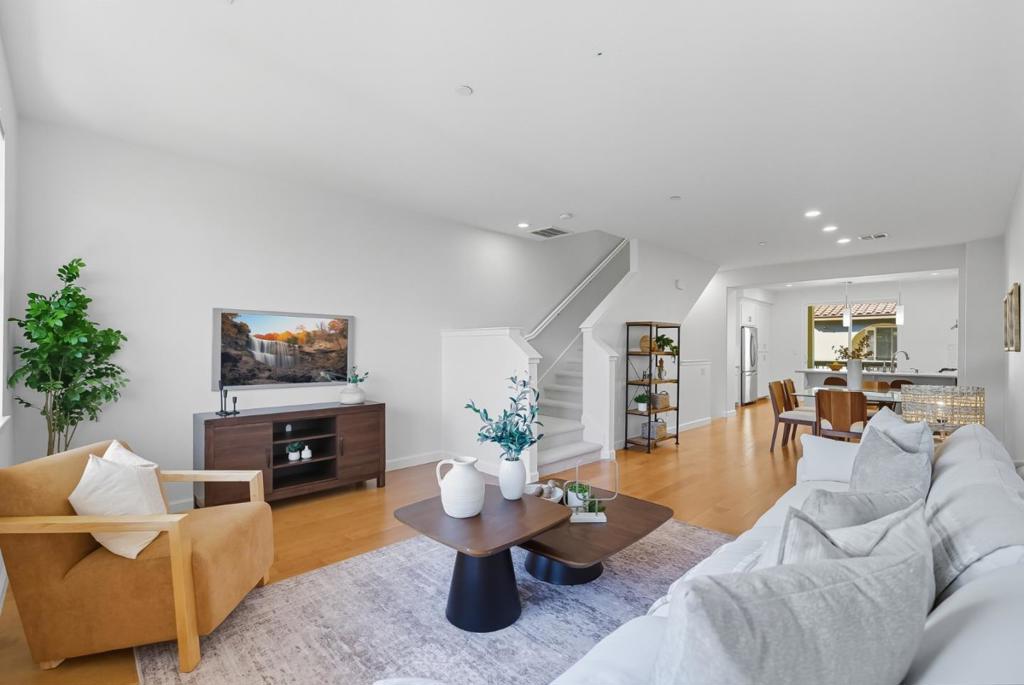 Highly Sought-After 3 Bed / 3 Bath Fusion Townhome in the Heart of Sunnyvale! This luxurious home has just been refreshed w/ new paint throughout and brand new carpet, making it move-in ready. The spacious ground-level bedroom & bathroom are perfect for in-laws, visitors or rental income. Enjoy recessed lighting, vibrant hardwood floors, plush carpet, and tons of natural light. The formal entry leads upstairs to an open-concept living and dining area. The fully upgraded gourmet kitchen features top-of-the-line granite counters, stainless steel appliances, a stylish tile backsplash, a workstation, and a cozy balcony. The oversized owners suite offers two walk-in closets, dual sinks, and a large stall shower w/a separate toilet. A spacious junior suite with a full bath and laundry located upstairs. Ample storage throughout. 2 Car Garage. Endless Community amenities include a movie theater, clubhouse, fire pit, gym, play area, putting green, and more, all with a low HOA fee. Easy access to major freeways such as 101, 85 and 237. Near multiple Sunnyvale parks such as Swegles, Muwekma and Wiser Park, all within walking distance. Ideal location near Amazon, Apple, Google, Nvidia & more! Located minutes from Downtown Sunnyvale w/dining, shopping & entertainment! Don't miss out!