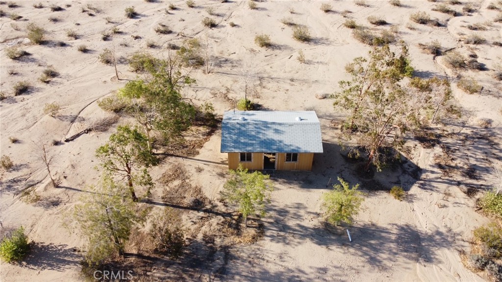 Check it out! 5 acre property with a small cabin on you can update yourself or build on instead! Landscaping is maintained by the seller, and is on a sprinkler system which are battery operated, and located in the cabin. Buyer to verify water availablity with 29 Palms Water District. Come take a drive and see for yourself! Rural living with panoramic desert views! This a great opportunity for anyone!