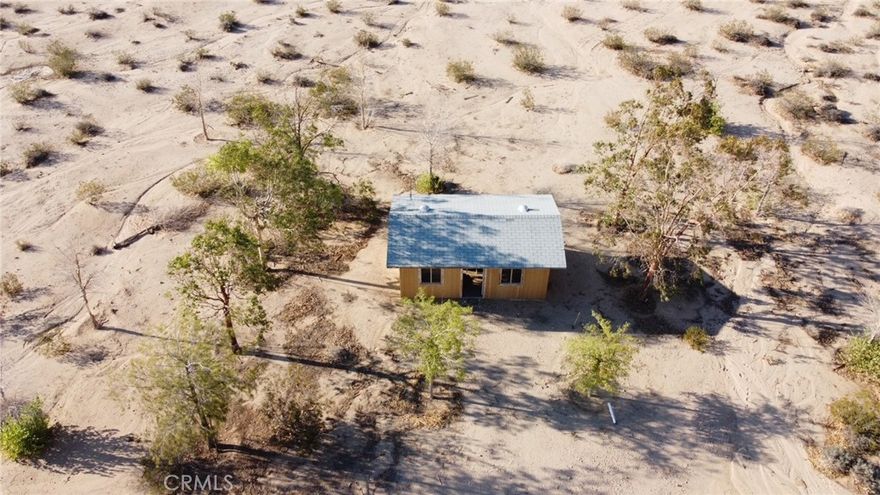 Check it out! PRICE IMPROVEMENT! 5 acre property with a small cabin on you can update yourself or build on instead!  Landscaping is maintained by the seller, and is on a sprinkler system which are battery operated, and located in the cabin.  Buyer to verify water availablity with 29 Palms Water District. Come take a drive and see for yourself! Rural living with panoramic desert views! This a great  opportunity for anyone!
