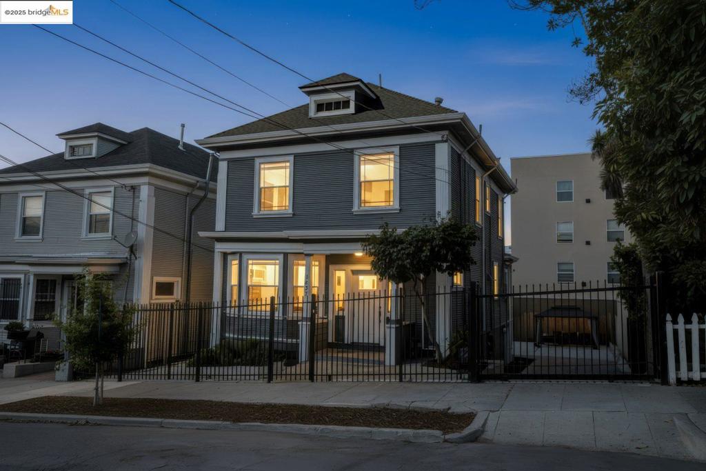 Welcome to 1837 7th Ave, an Ivy Hill gem minutes from Lake Merritt. This beautifully home blends character with thoughtful updates for the perfect mix of charm and efficiency. Sunlit living spaces feature updated floors and timeless architecture, with French doors opening to the living room and original pocket doors leading to the dining room with built-in cabinetry. The updated kitchen is ideal for hosting, with stainless steel appliances and an adjacent laundry room with LG washer/dryer and a full bath. Upstairs, a spacious primary en-suite offers a large bath, joined by two more bedrooms and another full bath. Original hardwood floors run throughout the upstairs, adding warmth and character. Upgrades include fully paid-off solar panels and a high-quality electrical panel for long-term value and efficiency. Outside, enjoy a private backyard retreat with a remodeled deck, fruit trees, and a large gazebo, perfect for entertaining. A roomy basement allows for more storage, income opportunities, or a future remodel. An electric gate provides secure off-street parking and a spacious driveway. Conveniently located near parks, shops, and commuter routes to downtown Oakland and SF, this is a rare opportunity to own a move-in ready sanctuary in Oakland’s beloved Ivy Hill neighborhood.