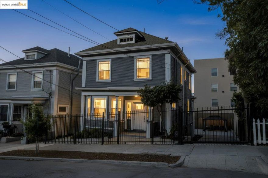 Welcome to 1837 7th Ave, an Ivy Hill gem minutes from Lake Merritt. This beautifully home blends character with thoughtful updates for the perfect mix of charm and efficiency. Sunlit living spaces feature updated floors and timeless architecture, with French doors opening to the living room and original pocket doors leading to the dining room with built-in cabinetry. The updated kitchen is ideal for hosting, with stainless steel appliances and an adjacent laundry room with LG washer/dryer and a full bath. Upstairs, a spacious primary en-suite offers a large bath, joined by two more bedrooms and another full bath. Original hardwood floors run throughout the upstairs, adding warmth and character.  Upgrades include fully paid-off solar panels and a high-quality electrical panel for long-term value and efficiency. Outside, enjoy a private backyard retreat with a remodeled deck, fruit trees, and a large gazebo, perfect for entertaining. A roomy basement allows for more storage, income opportunities, or a future remodel. An electric gate provides secure off-street parking and a spacious driveway. Conveniently located near parks, shops, and commuter routes to downtown Oakland and SF, this is a rare opportunity to own a move-in ready sanctuary in Oakland’s beloved Ivy Hill neighborhood.