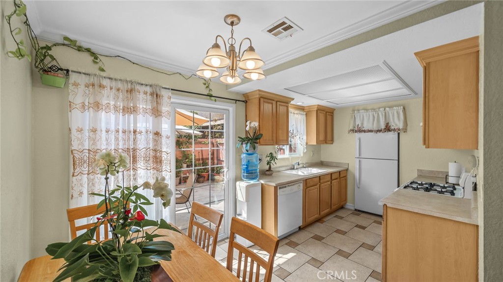 Peaceful and inviting single level (no upstairs neighbor), two bedroom, one bath condominium in a gated community. This gem has lots of natural light shining through energy efficient double-paned windows, featuring a spacious living room, dining area and kitchen with sliding glass doors that open to a spacious outdoor patio. Other features include tile flooring throughout, in-door laundry area, recessed lighting and central air cooling & heating. There are only 8 units in this quaint condominium community, and the HOA is only $75 per month! Walking distance to restaurants, supermarkets, parks, churches, schools, a gym, a popular coffee shop, giant retailers, and so much more!