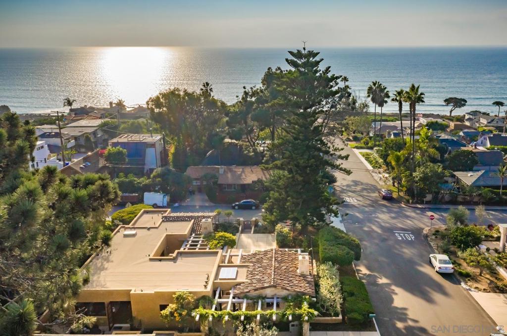 Panoramic ocean view estate situated on a fully gated corner lot in the heart of Del Mar. Walk to the beach & the area's best restaurants & shops. Entry-level master bedroom with 4 more bedrooms downstairs. Enjoy a movie theater, ocean-facing office/bonus room with fireplace, as well as multiple patios with outdoor BBQ, fountain, fireplace & more. Watch the sunset on the front patio complete with grassy lawn & mature foliage. An opportunity not to be missed. This special location cannot be beat!