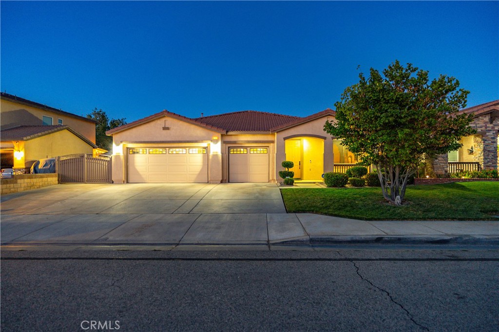 ***LIVE BEAUTIFULLY*** Upgraded 4-Bedroom Single-Story Home w/ A 3 Car Garage, RV Access, & Paid Solar In West Lancaster! From the moment you arrive, you’ll be captivated by the gorgeous curb appeal, complete with lush green grass, a charming front porch, and a mature shade tree that adds to the home's inviting presence. This home offers paved and gated RV access, paid-off solar for incredible energy savings, a water softener system, and solar screens on the windows for enhanced comfort and efficiency. Enjoy summer days in the above-ground pool, and entertain with ease in the expansive backyard featuring an extended covered patio with built-in lighting and a custom built-in BBQ—perfect for hosting family and friends. Inside, you'll find a spacious, open-concept layout, where the kitchen flows seamlessly into the family room with a cozy fireplace and direct backyard access. The kitchen is a chef’s dream, offering ample cabinetry, granite countertops, center island with barstool seating, and double convection ovens for culinary convenience. The primary suite is a true retreat, thoughtfully separated from the secondary bedrooms for ultimate privacy. It has been completely remodeled with premium flooring, a generously sized walk-in closet, and a luxurious spa-like bathroom boasting tile flooring, a jetted soaking tub, custom dual vanities, and a stone-tiled walk-in shower. Each of the remaining three bedrooms features ceiling fans and is ideally located on the opposite side of the home. An indoor laundry room adds extra ease to daily living. With paid solar, RV parking, upgraded features throughout, and a backyard made for entertaining, this home offers an unbeatable combination of comfort, style, and functionality. Don’t miss your opportunity to own this West Lancaster beauty—schedule your private showing today!
