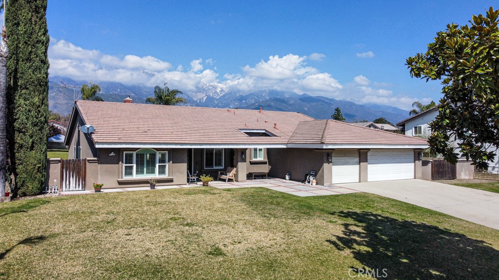 STUNNING UPLAND POOL HOME – Located in a serene foothill neighborhood at the base of Mt. San Antonio, this unique property is ready for a family to call it home. Walking through the heavy wrought iron double door entrance, you will immediately notice the custom upgrades and craftsmanship of work -- beautiful flooring throughout, vaulted ceilings, stone fireplace, and a flowing floor plan that brings everything together. The kitchen includes white shaker cabinetry with plenty storage space, granite counter tops with full height back-splash, kitchen island, breakfast counter, and stainless steel appliances. The LARGE master bedroom feels like a suite and has two closets and remodeled bathroom. The other bedrooms and closets are all very spacious. Furthermore, this home is perfect for entertaining -- enjoy your own private oasis with a lush, park-like backyard, mature landscaping, a covered patio, and breathtaking mountain views from the poolside or under the stars in the soothing jacuzzi. Lastly, the property also includes an oversized 3-car garage and side gate access for potential RV parking in the backyard. This one is turn key and ready to move in. Take advantage of this rare opportunity and make this custom home yours TODAY!!!