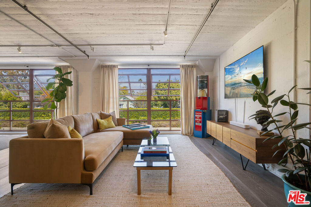 Chic Live Work Loft in Coveted South Pasadena. 812 Fremont Avenue #203 is located in the historic Mission District Lofts. Originally constructed in 1925 as part of the area's commercial industrial hub and transformed in 2003, these lofts feature open floor plans with expansive awning windows and offer flexibility for both residential and live-work spaces. Unit #203 has high ceilings, exposed cinder block walls and Industrial ductwork complemented by sleek, wide-plank wood floors. The space is open and bright, blending urban-industrial design with modern comforts like a charming blue kitchen area and side-by-side washer dryer. This inspiring space is wildly versatile, great for living, live-work, work from home, entertaining, studio, creative work, collaborative projects and more. And the South Pasadena location is unparalleled: shops and restaurants in all directions, right by the Gold Line metro station, award winning schools, South Pasadena Library, South Pasadena's weekly Farmer's Market, quarterly arts crawls and annual music festival. Sweet small town vibes in the middle of a thriving urban area. Local favorites: Jone's Coffee, Mission Wine, Fiore Market Cafe, The Dinosaur Farm, Krispy Kreme Donuts, Heirloom Bakery, South Pas Vintage.