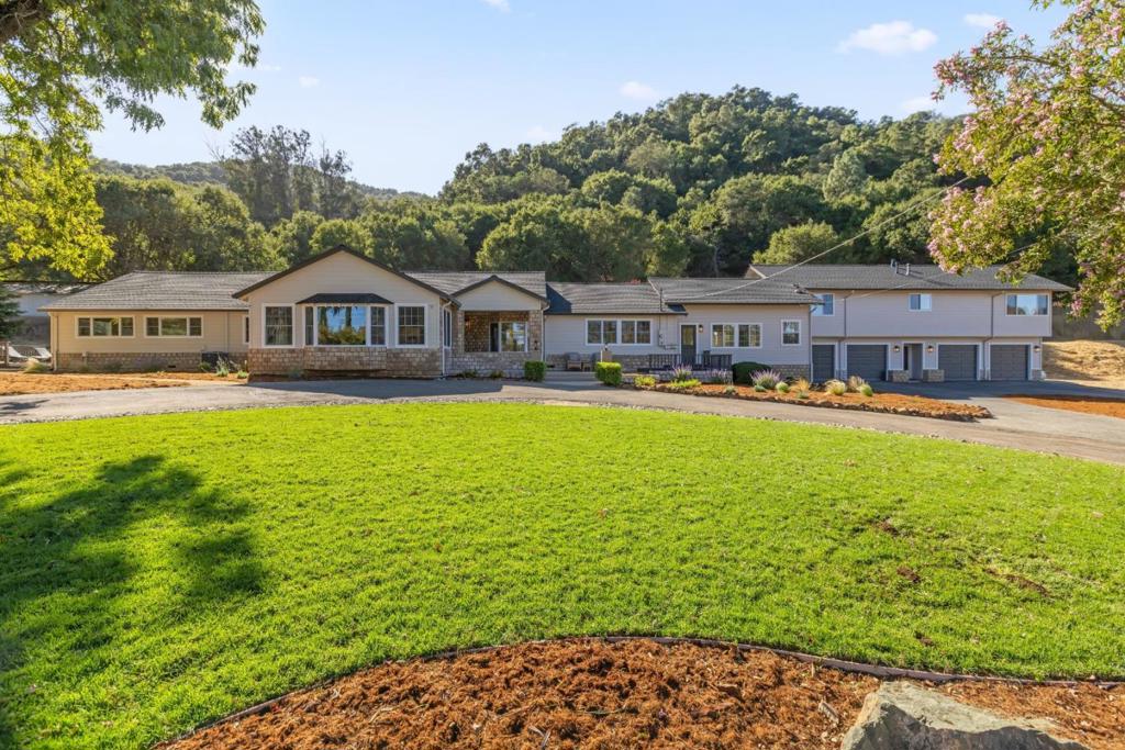 Welcome to a serene oasis in Paradise Valley! This stunning residence is nestled on approximately 25 acres of picturesque land, offering the perfect blend of privacy and comfort for a larger family. With 4 bedrooms, 2.5 bathrooms, this home provides ample space for relaxation and entertaining. Enjoy the added convenience of a bonus room, which can be used for office or game room. Multiple decks surround the home, inviting you to savor the breathtaking views and the tranquility of nature. Additionally, the attached guest quarters complete with its own private entrance houses 2 more bedrooms, 1 bath & kitchen, is ideal for extended family or as an income-producing rental. With approximately 2 acres of flat, usable land at your disposal, you have endless possibilities whether it's creating your dream garden, hosting outdoor gatherings, or enjoying recreational activities. This beautiful property is a true retreat while still being conveniently located near local amenities.