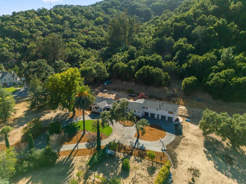 Welcome to a serene oasis in Paradise Valley! This stunning residence is nestled on approximately 25 acres of picturesque land, offering the perfect blend of privacy and comfort for a larger family. With 4 bedrooms, 2.5 bathrooms, this home provides ample space for relaxation and entertaining. Enjoy the added convenience of a bonus room, which can be used for office or game room. Multiple decks surround the home, inviting you to savor the breathtaking views and the tranquility of nature. Additionally, the attached guest quarters complete with its own private entrance houses 2 more bedrooms, 1 bath & kitchen, is ideal for extended family or as an income-producing rental. With approximately 2 acres of flat, usable land at your disposal, you have endless possibilities whether it's creating your dream garden, hosting outdoor gatherings, or enjoying recreational activities. This beautiful property is a true retreat while still being conveniently located near local amenities.