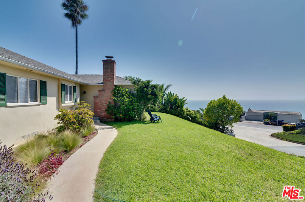 Perched high above the Pacific on a quiet street in Pacific Palisades, this beautifully restored 3-bedroom, 2-bath home offers absolutely breathtaking, unobstructed ocean views. The property has undergone full restorative services since the fires and is now 100% up to code, giving peace of mind for years to come. Inside, enjoy refinished hardwood floors throughout, two fireplaces, and brand-new stainless-steel appliances plus a new washer and dryer. Generous closet space, many built-ins, and light-filled rooms add comfort and functionality. Step outside to a private, expansive backyard with a brand-new metal fence and a covered patio, perfect for entertaining or simply soaking in the panoramic ocean views. Additional highlights include a 2-car garage, top-rated school district, and an ideal location just above PCH with easy access to Santa Monica, Malibu, Brentwood Village, Palisades Village, UCLA, and the area's best dining. A rare opportunity to live in a serene community with lovely neighbors and endless views of the Pacific. This is an absolute steal. Long term inquiries.