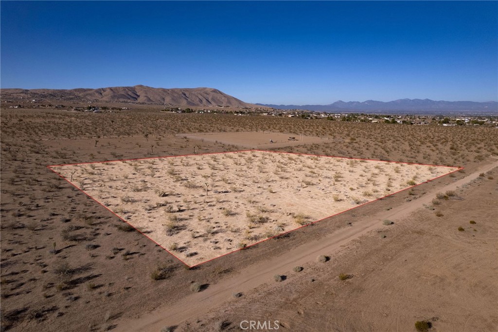 Unlock the freedom of 2.3 flat, buildable acres in Apple Valley. Peace, space, and wide-open desert beauty - yours to shape. Bring the RV, the toys, the vision. The sky’s the limit. But move fast... this one won’t wait.