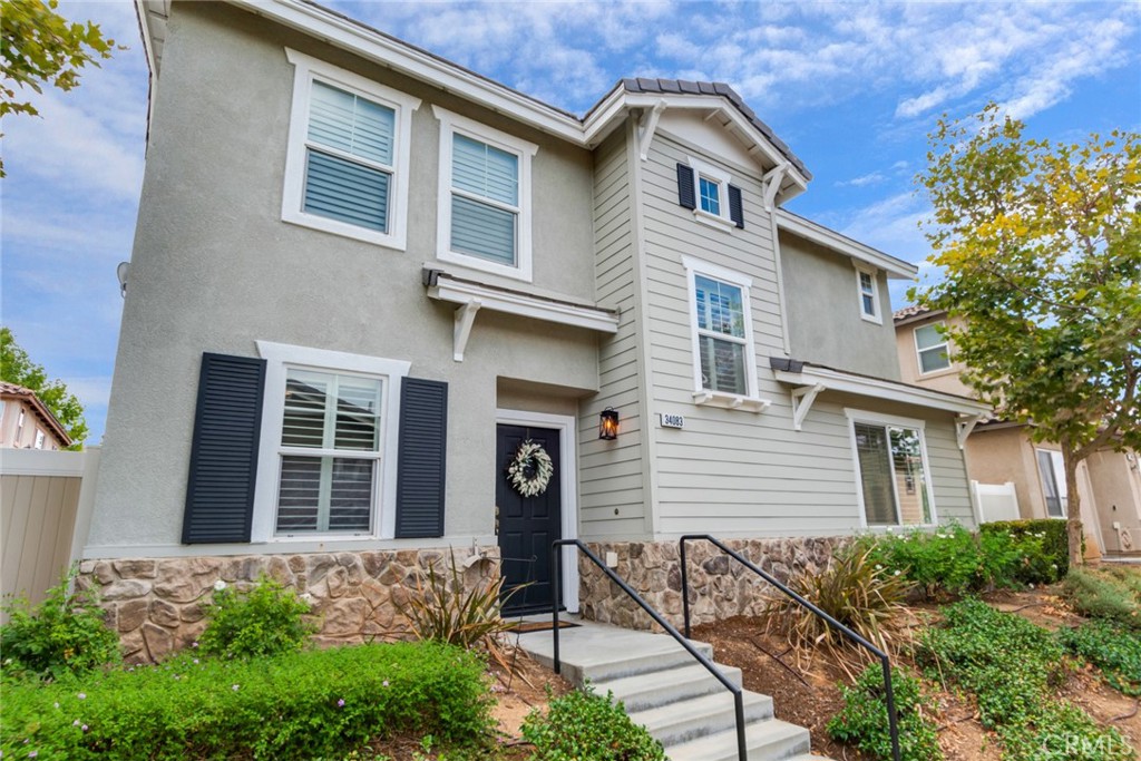 Welcome to Iris Gardens. This gated community caters to the active life style, with a pool/spa, a gym, playground, front yard maintenance and more. This 3 bedroom, 2.5 bath home is nicely upgraded with laminate floors, plantation shutters and quartz countertops. The kitchen is open to the family room with a breakfast bar and eating area. The living room off of the entry can be also be a formal dining room. The bedrooms are all good size with the primary boasting a walk-in closet and a spa type bath with soaking tub and separate shower. The two secondary bedrooms have direct access to the bath and the laundry is upstairs for great convenience. A private patio with privacy fencing allows for outdoor entertaining and the two car garage is attached. A pretty home indeed!
