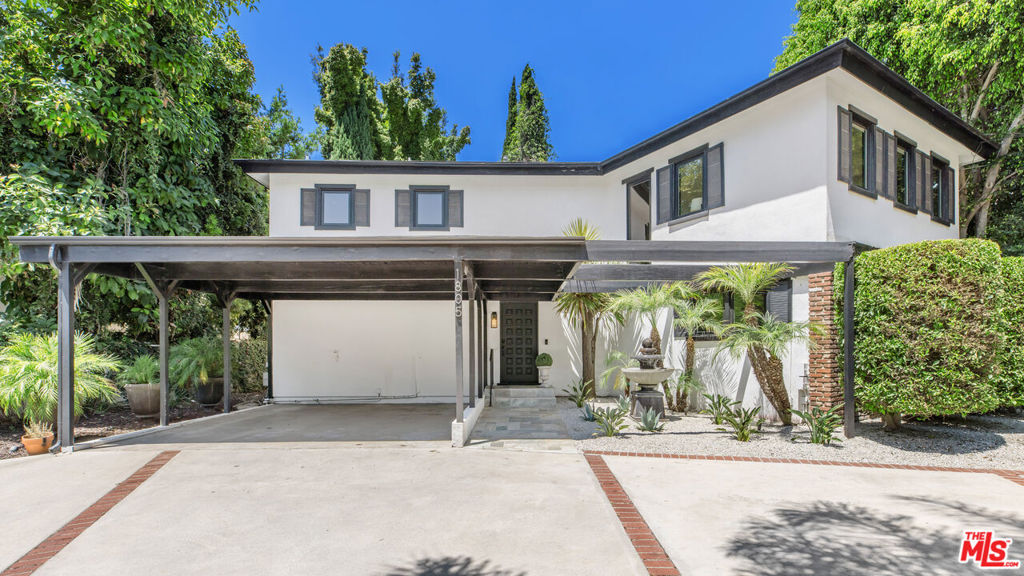 Modern Elegance Meets Timeless Design in Prime Beverly Hills. This beautifully reimagined Beverly Hills residence seamlessly blends refined sophistication with modern comfort. Remodeled and cared for by the current owner multiple times with the most recent transformation completed between 2020 and 2021, every inch of this home reflects thoughtful craftsmanship and luxury upgrades.Step inside to find a sleek Italian-designed kitchen featuring handle-less cabinetry, under-cabinet lighting, a Kohler sink, Brizo SmartTouch faucet, filtered water tap, and a suite of Thermador smart appliances, including an oven, convection microwave, and warming drawer. The wine and beverage fridges are all seamlessly integrated into the oversized island, perfect for entertaining. New engineered hardwood floors run throughout the home, complemented by crown molding, solid core interior doors, and Marvin windows and sliding doors with hidden screens that flood the space with natural light. All bathrooms have been fully renovated with upscale finishes. The spa-like primary suite boasts Porcelanosa tile, Restoration Hardware vanity and cabinetry, a bidet toilet, and a California Closets walk-in with a hidden built-in safe. Lighted, anti-fog mirrors add a modern touch to each bathroom, and both upstairs baths offer deep soaking tubs for ultimate relaxation. Additional features include: Two new AC units (separate zones for upstairs/downstairs). Two tankless water heaters, including one dedicated to the primary bath. New electrical panel and EV charging outletIntegrated. Sonos speakers in the main living areas and primary suite. Smart LG washer (2025) and dryer (2005). New bar matching the Italian kitchen design. Meticulously updated, freshly painted, and move-in ready, this home offers a rare opportunity to enjoy elevated living in one of Los Angeles' most prestigious neighborhoods.
