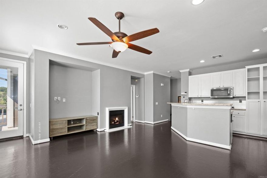 Wow - Beautiful End Unit - Highly Upgraded - Belleze Beauty - Original Owner - Next to Guest Parking - Great Unit - Only one stairway to main area - Features open floor plan - Center island - Beautiful white blinds - Crown moldings - Neutral flooring - Large master area & walk-in w/built-in storage racks - Beautiful granite topped vanities - Wide Baseboards - Stacked washer & dryer - Fireplace - Upgraded stainless steel appliances - The complex features a park and playground - The San Miguel HOA features pool/spa, workout area, sports court, splash area - Clubhouse features catering area for large events - Close to shopping