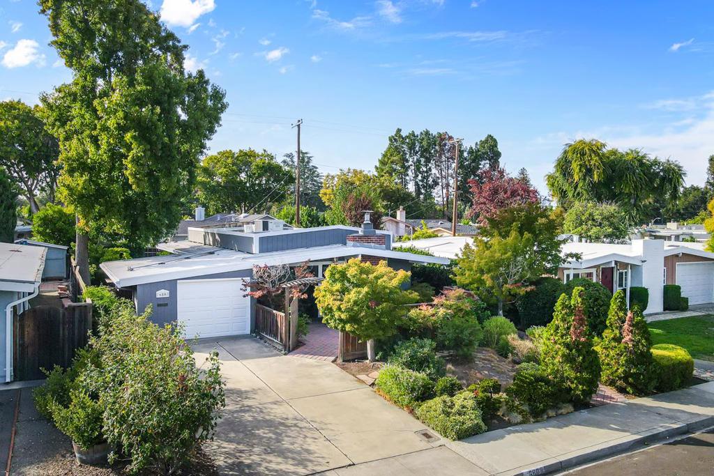 Step inside this impeccable mid century modern Santa Clara home (converted from 4 bedrom home can be easily converted back to 4 bedrooms). The bright & Spacious open living room with pitched ceiling that enhances the sense of spaciousness. The kitchen is a delight, offering a sunlit workspace with ample countertops for your culinary needs. Primary suite provides a quiet retreat with private bath. In-unit laundry adds everyday convenience. The home has an oversized bedroom with 2 closets & can be used as a flexible space, perfect for a home office, gym or converted back to 4 bedrooms. Outdoor living is a highlight of this property. The front courtyard is a serene retreat, fully fenced, complete with pavers & featuring graceful Japanese maple trees. The backyard is an entertainer's dream, boasting a spacious deck with built-in seating & patio area with pavers. Mature trees provide shade & a sense of privacy, creating the perfect backdrop for gatherings or quiet moments. The home also features one car garage with automatic opener, storage cabinets, central heating/AC, dual pane windows & LVP flooring throughout. Conveniently situated near shopping, commute routes & major tech companies like Apple and Nvidia. Easy walking distance to beautiful Homeridge Park & Sutter Elementary.