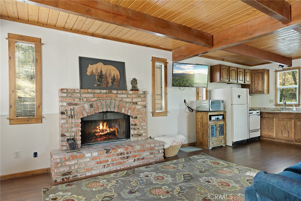 Welcome to your chill-out zone in the San Bernardino Mountains. Tucked away on a rare double lot in Arrowbear, this cabin-style getaway backs directly to the national forest, so your backyard is literally trees, trails, and fresh alpine air.Inside, the open-concept main floor flows out to a huge deck—perfect for après-ski drinks, summer BBQs, or pretending you’ve finally figured your life out. Upstairs, the spacious primary bedroom feels like a retreat, while the cozy bunk room fits three kids or a few friends who still think sleeping bags are a good time. The full bath keeps everyone functional and clean (you’re welcome). Plenty of flat parking means you’re not battling the slope every time you show up. You're just a short stroll from Arrowbear Lake and park, and only minutes to Snow Valley, SkyPark at Santa’s Village, and all the action in Big Bear. Whether you’re after weekend ski trips or a full unplug-from-the-city sanctuary, this one checks the boxes. Come see it before someone else steals your dream cabin. Modern Cabin Vibes. Forest Views. Zero Stress.