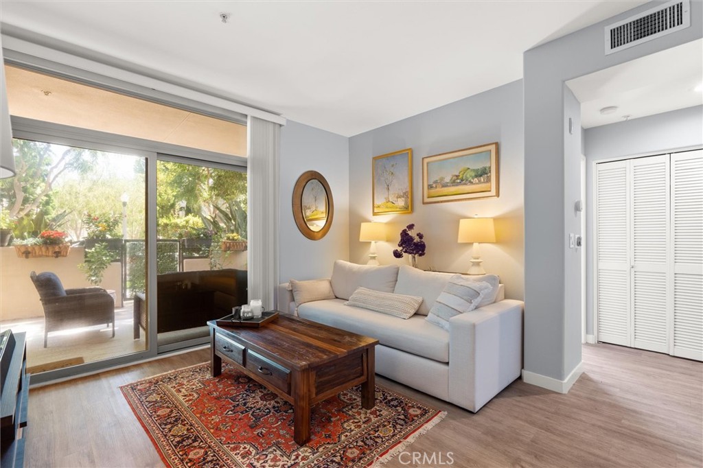 **Available partially or fully furnished!** Welcome to The Promenade. A rare first floor, single-level corner home with direct street access that lives more like a private residence than a condo. Inside, a bright open layout features 2 bedrooms, 2 bathrooms, and a versatile den/flex room, enhanced by high ceilings, floor-to-ceiling windows, and an oversized patio ideal for entertaining or unwinding. Bedrooms are set on opposite sides for added privacy, each with walk-in closets and patio access. Life at The Promenade means enjoying all that Playa Vista has to offer, including exclusive access to The Resort and The Center Pointe Club with sparkling pools, modern fitness centers, sports courts, soccer fields, playgrounds, and dog parks. Just a short stroll or PVCS shuttle ride connects you to Playa Vista Elementary, Concert Park, and Runway Village—home to shops, dining, entertainment, Whole Foods, CVS, and more. More than a home, it’s the best of the Playa Vista lifestyle.