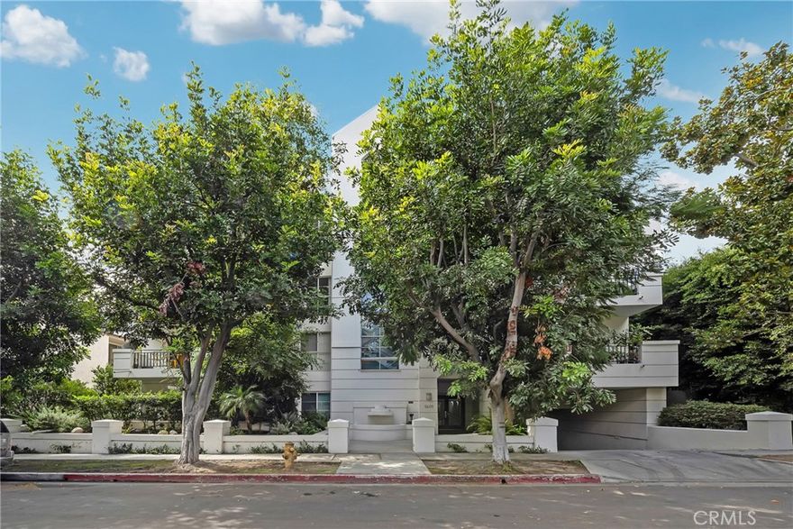 Light-filled and newly refreshed 2-bedroom, 2.5-bath corner unit offering approximately 1,525 sq. ft. of comfortable living space in a prime Westwood cul-de-sac. Located in a secure, controlled-access building, this spacious condo combines an ideal floor plan with stylish updates that make it move-in ready. The home features high ceilings, a formal entry, and an open living and dining area with fireplace, wet bar, and sliding glass doors to a private patio, perfect for indoor-outdoor entertaining. The kitchen and bathrooms have been upgraded with new tile and lighting, creating a more contemporary feel. Both bedrooms include ensuite baths for privacy and comfort, while the oversized primary suite offers a walk-in closet, marble-accented bath, spa tub, separate shower, and dual-sink vanity. Additional highlights include a guest powder room, in-unit laundry, central HVAC, two tandem parking spaces in a secured garage, and a pet-friendly HOA. Perfectly situated near UCLA, Westwood Village, Century City, and Beverly Hills, with convenient access to the 405 and 10 freeways and within the Fairburn Elementary School district. This freshly updated condo delivers exceptional value, generous space, and a turnkey lifestyle under $1M in one of West LA’s most sought-after neighborhoods.