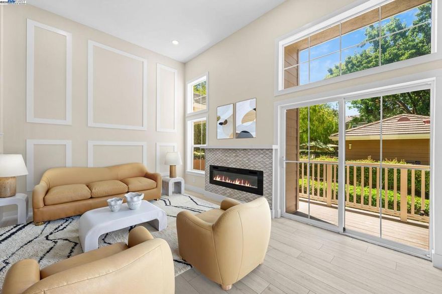 Stunning RENOVATED, no occupancy thereafter. Move in ready. Special financing at 4.875%, buy down paid by seller, ask for details.  Corner/end unit, open on 3 sides, you'll enjoy a serene living experience. Entering, you'll be greeted by a decorative foyer with beautiful tiles. The high ceiling creates openness that is complemented with plenty of natural lights. The designer flooring throughout the property creates uniformity. The kitchen, nook, family room, and formal dining areas are thoughtfully separated, providing ample space for relaxation & entertainment. The kitchen is a highlight, featuring a farmhouse sink, upgraded faucet, quartz countertops & backsplashes, & sleek new LG brand stainless-steel appliances. Recessed lighting in the property can be adjusted to a soft, warm halo glow, creating a cozy ambiance. A stunning electric fireplace with multiple color settings adds a touch of sophistication to the living room. The primary bedroom is a serene retreat, nestled in a private location w walk-in closet.  This tranquil oasis opens to the inviting pool view & trees, perfect for privacy & relaxation. The piece of resistance is the stunning shower area, complete with a cozy niche & comfortable bench & barn door.