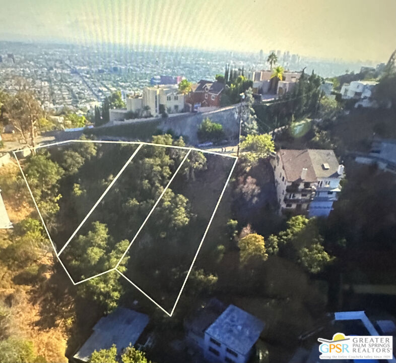 Rare top of the mountain Canyon and City View lot. Downslope parcel with easy access on Grand View Dr. This parcel is part of 3 contiguous lots that may be purchased individually, or all three lots, and build a much larger home in desirable Laurel Canyon.