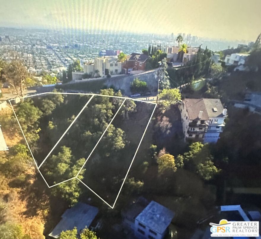Rare top of the mountain Canyon and City View lot. Downslope parcel with easy access on Grand View Dr. This parcel is part of  3 contiguous lots that may be purchased individually, or all three lots, and build a much larger home in desirable Laurel Canyon.