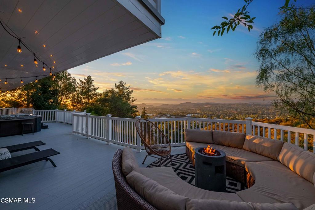 Top-of-the-World Views + Bonus Lot + Stunning Upgrades!Perched at the top of McKnight Road with no neighbors above and privacy all around, this one-of-a-kind home offers breathtaking panoramic views across the entire Conejo Valley from all three levels. Enjoy peaceful outdoor living on expansive wrap around decks with phenomenal views, featuring an above-ground Marquis Vector spa. Inside, the flexible layout includes a spacious great room, chef's kitchen with granite island and views views views. Occupying the third level exclusively - the primary suite retreat boasts complete privacy and a private balcony for indoor/outdoor living. In addition, three well-appointed bedrooms are conveniently located on the main living level. The 3rd bedroom (no closet - shown in pictures with bunk beds) that can convert to a perfect office/den. A lower-level game room/den suite with its own family room, gym, mini bar, hot sauna with shower and separate entrance--perfect for guests or multi-generational living, or kids!Thoughtfully updated throughout with new AC, new paint, new bedroom flooring, new lighting fixtures and new exterior doors. This home blends modern convenience with timeless charm. The original sanded and restained hardwood floors shine on the main level, while drought-tolerant landscaping enhances curb appeal. Additional highlights include an upgraded security system, solar power, a new sliding door to take in the views on the main floor, an upgraded downstairs bath, and a brand-new minibar in the primary suite.Bonus: Includes the adjacent parcel--over 41,000 sq ft combined-- a rare opportunity for an owner-builder, investor, or anyone seeking space and potential.This is more than a home--it's a lifestyle on your own private mountaintop.