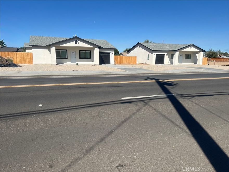 Two identical 2025 new homes with all the bells and whistles. Buy one, have your relative, friend or coworker buy the other, and have a good neighbor for life. In fact, if you recommend your neighbor and he/she buys, you will get up to $10,000 towards your closing cost. The house has quartz counter top, three car tandem garage, tankless water heater and backyard big enough to build another three bedroom ADU. House is located a few minutes drive to Adelanto main post office, schools, new Adelanto shopping center and food stores. Come take a look and you will fall in love with this new home. The sheriff's office is just around the corner.