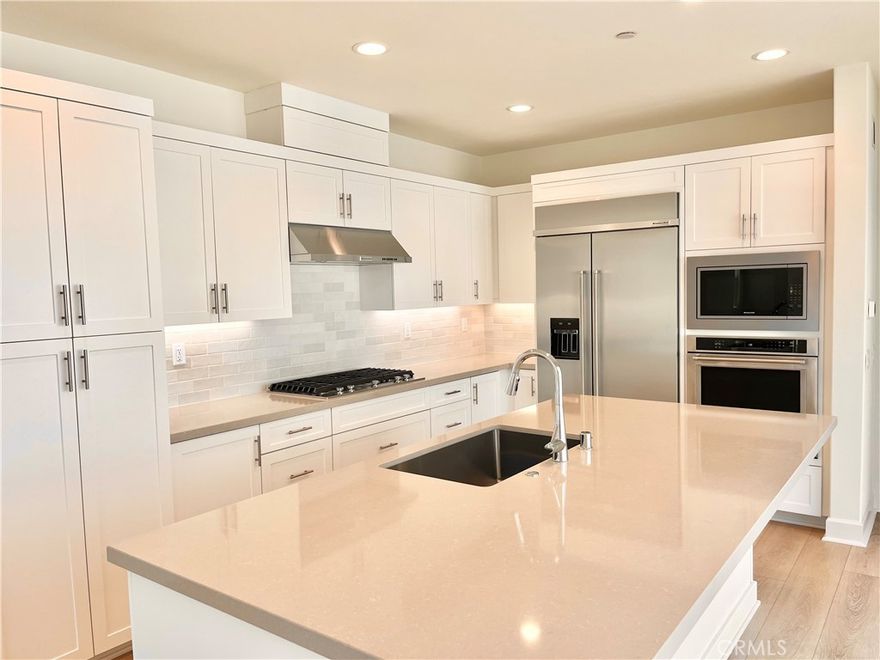 Great opportunity to own a brand new home withing minutes to the beach! Our 2-level single family residence is a 4 bedroom with one bedroom and bath on the main floor. Loft area upstairs plus another open flex area. Open concept floor plan with upgraded quartz countertop and designer backsplash at kitchen. Kitchen island with breakfast bar. Beautiful primary bedroom suite with walk-in closet. Upstairs laundry. KitchenAid appliances with gas stove and refrigerator included. Amenities include a community pool, spa and recreation center. HOA fees starting around $165 and going down to around $105 at build-out. Home is ready for move-in.