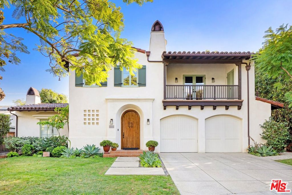 Nestled at the end of a quiet cul-de-sac in a coveted Brentwood enclave, 12234 Falkirk Lane is a stunning Santa Barbara Spanish-style home that offers luxury and comfort in an idyllic setting. This 4-bedroom, 5-bathroom retreat spans 4,146-square-feet of light-filled living space set on a spacious, hedge-lined 9,246-square-foot lot for the height of refined LA living. The stylish interiors immediately captivate with character details like arched doorways, high beamed ceilings, and built-ins. Enjoy effortless entertaining with a formal living room and dining room that opens to a tranquil courtyard, while the open-plan kitchen and family room leads to the backyard through a double set of French doors. Set beneath skylights and accented by top-tier finishes, the gourmet kitchen comes complete with Limestone countertops, Viking appliances, two dishwashers, and a large seated island. Ideally positioned on the first level, the expansive primary suite is a peaceful retreat with a luxe ensuite bathroom and a generous walk-in closet. Three additional bedrooms are upstairs, two with en suite baths and private balconies. Other notable features include an upstairs family room set around a charming fireplace, surround sound, and an attached two-car garage. Located just moments from Brentwood's most popular dining, shopping and entertainment offerings like the Brentwood Country Club, Country Mart and Farmers Market, this serene property offers an idyllic blend of timeless luxury and modern comforts.