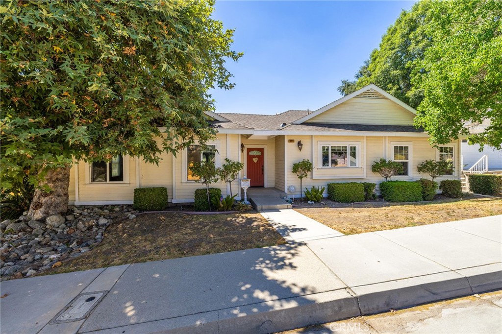 Charming Corner Lot Home in North Glendora. Situated on a desirable corner lot in north Glendora, this beautifully maintained home, built in 2005, offers a spacious and open floor plan ideal for modern living. With inviting curb appeal, mature shade trees, and a welcoming covered front porch, this home sets the tone from the moment you arrive. Step inside to a tiled entryway that leads into an expansive family room featuring crown molding, recessed lighting, carpeted flooring, and a glass door that opens to the backyard. The open-concept kitchen boasts antique-style cabinetry, granite countertops, a stylish tiled backsplash, center island with bar seating, and a cozy breakfast nook with built-in bench seating. Just off the entry, a separate living room with double doors, a fireplace, and custom built-ins offers a warm and versatile space for relaxation or entertaining. The generously sized primary suite is filled with natural light and includes recessed lighting, a walk-in closet, and a well-appointed en-suite bath with dual sinks, a walk-in shower with glass enclosure, and a separate soaking tub with custom tile surround. Two additional bedrooms offer comfortable accommodations, including one with its own private en-suite. A full hallway bath and a separate laundry room with built-in cabinetry and exterior access add convenience and functionality. The backyard is designed for both leisure and utility, featuring a large concrete area with gated access for additional parking or RV storage, a grassy lawn, a detached two-car garage, and access to a basement for additional storage or potential expansion.