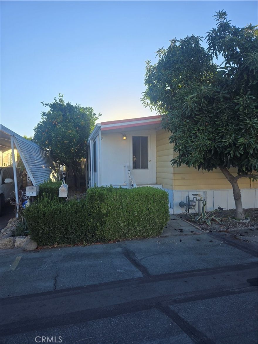 Make this home the first on your list, and it will be the last you look at. THE HOME is open, airy, and in a quiet area in east Hemet, close to shopping and transportation, and is a very popular senior park that includes a 9-hole Golf course. Very nice Clubhouse and facilities, pool, and many activities, hosted by the park. Although the home shows as a 2-bedroom home, it has a massive insulated sunroom, with no less than 5 entry and exit doors in and out of that area. Inside the home are all the appliances you need. The bedrooms are carpeted and of substantial size, and here's a treat you don't find very often: an awesome Jacuzzi tub. The secondary bathroom has a full shower-tub bathing facility to boot. Check the home out, and you'll see how well-maintained and upgraded the home is.