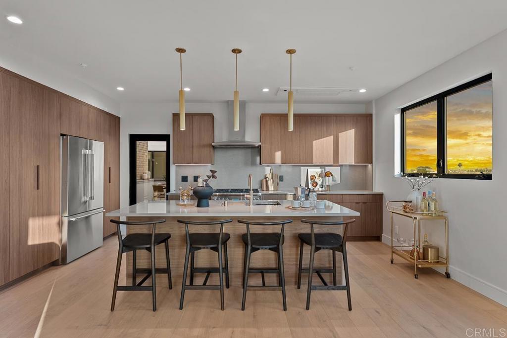 MODEL UNIT AVAILABLE TO TOUR - Welcome to Bay View 13, a new luxury townhome community in the Bay Park neighborhood of San Diego. Set on a bluff with breathtaking views of Mission Bay and the ocean, this exquisite three-level home at 4224 Tonopah (1 of 13 available homes) offers 3 bedrooms / 3.5 baths / office. The home features an open concept layout with designer touches, including a large kitchen island, solid surface quartz countertops with matching backsplash, and custom inset European slab cabinets. Enjoy the elegance of brushed gold kitchen hardware, Thermador appliances, floating iron staircases with custom glass work, engineered hardwood floors, and stylish lighting fixtures. The space is bathed in natural light from oversized windows and balcony slider doors. Spacious bedrooms all with on-suite bathrooms and three private decks totaling 154 sf. The 401 sf private garage is set up for EV charging and home comes with owned solar. Great central location provides easy access to transit, local dining, coffee shops, and the expansive Mission Bay Park, a 4,600-acre oasis perfect for biking, jogging, picnicking, and water sports. The expanded Blue Line (light rail), short walk away, connects to Downtown, UCSD, UTC, Sorrento Mesa and beyond. Call for details about buyer concessions which can be used towards a rate buy-down or home upgrades.