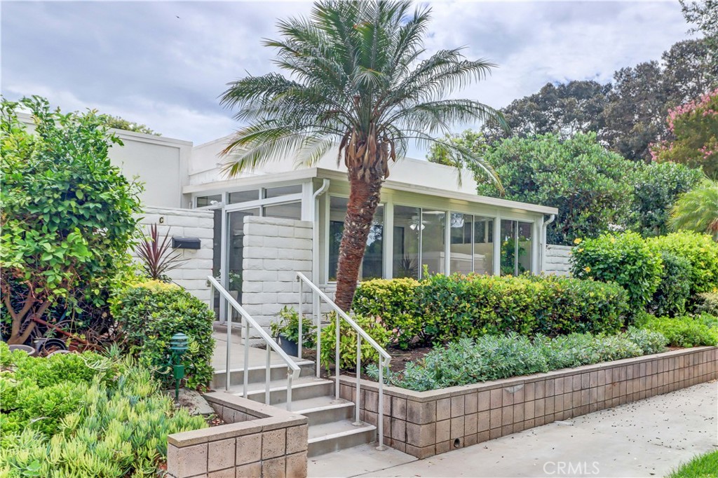 Upgraded "Coronado" co-op located in a beautiful area with sunny greenbelt location! Great improvements include enclosed front patio adding over 200 sq ft of living space (not included in sq footage total), brand new vinyl plank floors, fresh paint, ductless central mini-split system and partially open kitchen. Lovely setting close to carport and laundry room. Walk right up and notice the large patio storage cabinet and bright, enclosed sunroom with tile floors and light panels in the ceiling. Inviting glass front door leads to the living/dining area featuring 10 foot ceilings. There are 2 ductless mini-splits - one in living room and another in bedroom providing high efficiency heating and cooling. Kitchen area has been opened to provide easy interaction with the living room, cabinets refaced, brand new granite kitchen counters and microwave. Solartubes brighten the kitchen and bathroom areas. Bedroom and bathroom feature 7 foot doors to complement the high ceilings. There is a second mini-split in the bedroom to keep comfortable at night and large bathroom contains tub/shower combo. Laguna Woods Village residents enjoy a 27-hole championship golf course, a 9-hole executive par 3 course, pickleball and tennis courts, lawn bowling, gyms, clubhouses, swimming pools, horse stables, gardening centers, artist studios, computer workrooms and classes + over 200 clubs and organizations.
