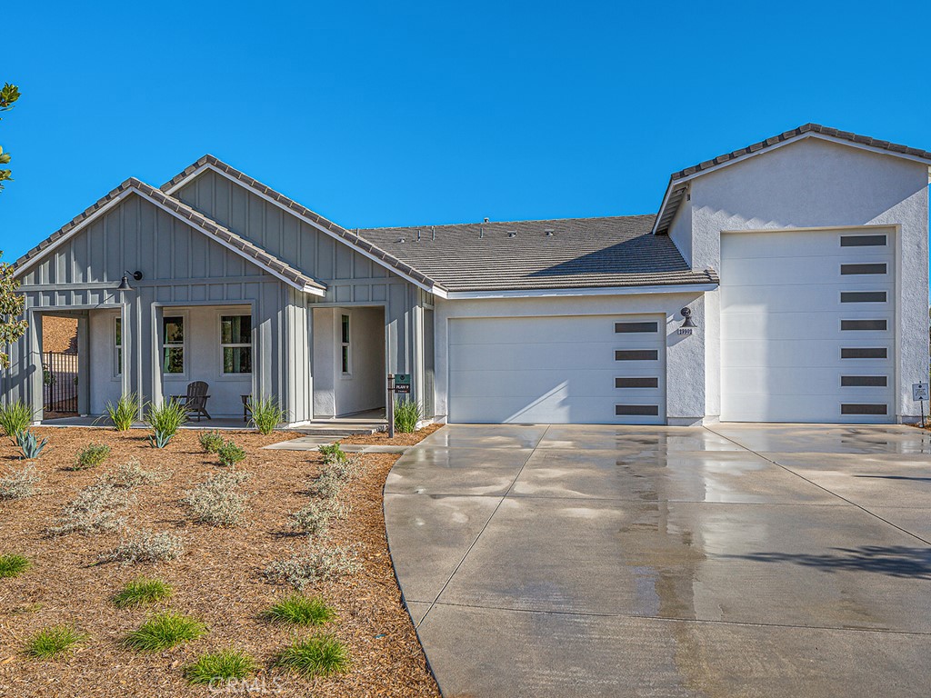 Quick Move-In Home with stunning views! Located in the community of Williams Ranch, a rural setting just minutes to all the best shopping and dining Valencia has to offer. If you are sick of only being able to choose from high-density communities just for the sake of convenience, then Williams Ranch has what you are looking for! Enter through an operating vineyard and five acres of citrus orchards owned and operated by the HOA! Walk almost five miles of paseos or spend the day at the junior Olympic swimming pool complete with cabanas, wine pavilion, amphitheater, and club house, it will exceed your expectations! Also, just minutes from the crystal blue waters of Lake Castaic that offer swimming, water skiing, camping and more. Williams Ranch offers 9 pocket parks throughout the community and a large public park just outside the gates! This community offers the total lifestyle that you cannot find any place else! This spacious single-story dwelling offers panoramic view of the mountains and neighborhood from the backyard and primary bedroom! When you enter this beautiful home, the foyer leads to an extensive Family Room which is ideal for gathering and entertaining your loved ones! Through the Family Room you access the Outdoor room where you can take a break while working from home. There is ample parking space for cars and even a workbench with a 2-car garage + tandem. The main living area showcases a large kitchen with an expansive island that flows into a separate dining room. The secondary bedrooms and primary bedroom are conveniently located on opposite ends of the home for ultimate privacy. The primary bedroom offers a private bath with a huge walk-in closet and a view of open blue skies!
Please, note that the pictures are of decorated Model Home Orchard collection - Plan 9 and the house does not include the option of R.V. garage. Call Williams Ranch Sales Office for more information about this wonderful home!