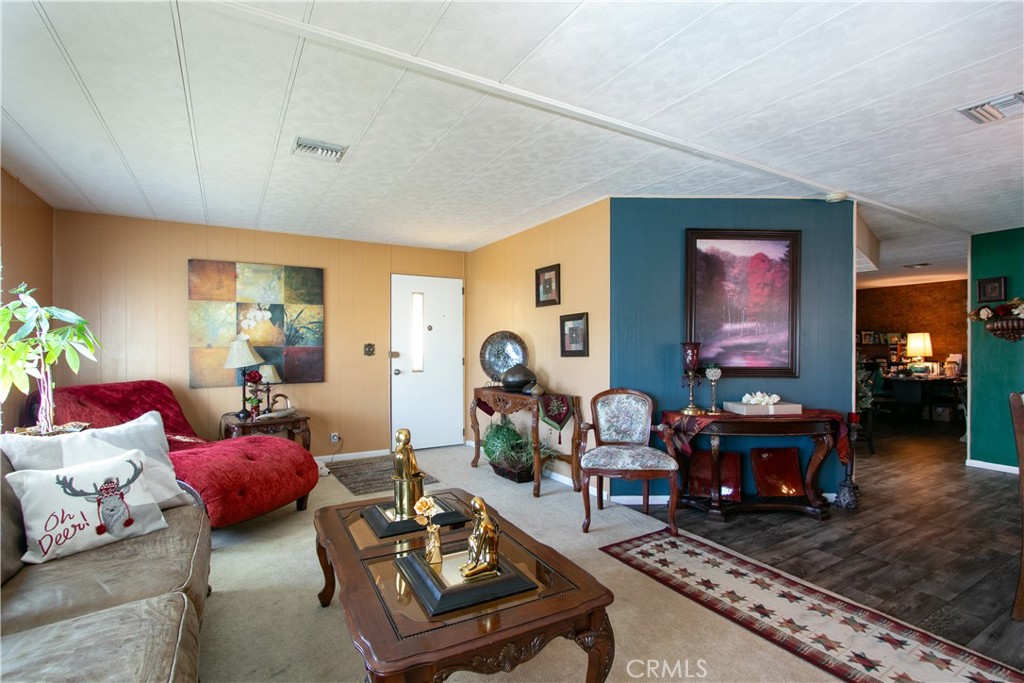 !!!! PRICE REDUCED !!!!!Beautiful Well, Maintained Manufactured Home located In Sunrise Estates 55+ Senior Park in Banning. 2 Bedroom ,1/ 3/4-bathroom, 1440 Sq. FT. Built 1975. This Coach has a 300 Sq, Ft. Additional Bonus Room. Nice walking -steps to main entry, Huge Living Room, Dining room, Open Kitchen to the Family Room, Newer Pain Inside, Wood Laminated Flooring, HVAC, Double Pane windows, and Carport. Back Yard has a few Fruit Trees, Amenities from the Park: Club House Pool and Spa and Card Tables. This Property Is located close to the Fwy 1-10 , Churches, Parks, Cabazon Outlets Mall, Casino Morongo.