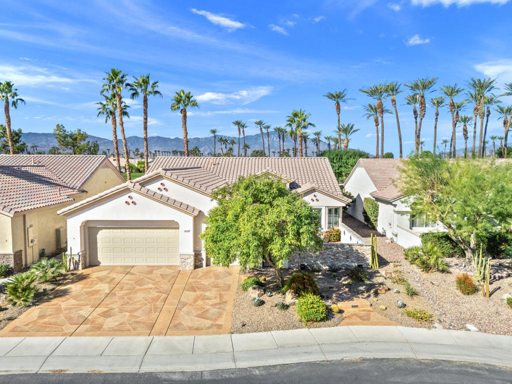 55+ Sun City Palm Desert--The ''Best BANG for your BUCK'' active retirement community in the whole Coachella Valley and beyond. Most popular St. Croix model with 2 beds/2 full baths, plus a DEN/HOBBY/FLEX room and golf cart garage. Spectacular golf course, sunset, mountain and lake views!!! GREAT location in the newer section of Sun City close to the Lake View Recreation Center. Stunning curb appeal features added courtyard patio wall for extra privacy with stacked stone, custom concrete overlay, desert landscaping with updated irrigation system, and courtyard and landscape lighting. Inside, NEWER AC in 2021, tile and plantation shutters throughout, new paint, new recessed lighting, all new ceiling air vents, Culligan water softener and reverse osmosis system. Kitchen features granite slab, quartz backsplash, pendant lighting over breakfast bar, refaced cabinets with hardware, upgraded stainless appliances and gas cooktop. The living room has a beautiful custom media center with touch lighting, the dining room has a brand new window, sliding door to the rear patio. The master bedroom is spacious, has a bay window with a window seat with a view, bathroom has double vanity, and closet system. Guest bedroom has fan/light, bath in hallway with a tub/shower combo. The famous DEN/HOBBY room is perfect for a TV room, office, workout room, and an extra guest space. The laundry room is inside, has cabinets and sink, washer and dryer are included (approx. 4 years old) Garage is extended, has epoxy flooring, new door opener, electric car charger, extra fridge and mini-split AC. NOW for the BEST PART!! Double fairway VIEWS of the golf course in both directions! Extended concrete patio with custom overlay, sparkling custom waterfall with stacked stone and new pump, French drainage system, added irrigation, landscape lighting. Perfect for relaxing and/or entertaining with family and friends for the holidays! ''Buy Where you Love to Play...Sun City Palm Desert!''