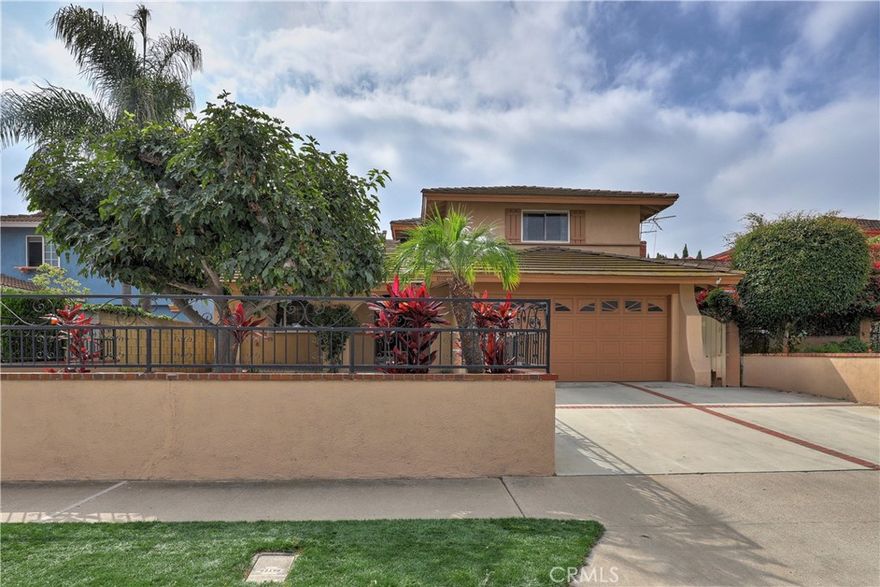Welcome to Orangewood Estates, 6906 Molokai Dr, a beautifully maintained and thoughtfully updated home nestled in the heart of Cypress. Offering 4 spacious bedrooms and 2 bathrooms across approximately 2,100 square feet of living space, this home sits on a 5,000 square-foot lot in a highly desirable neighborhood within the Garden Grove Unified School District.

Step inside to discover a bright and open layout featuring an updated kitchen complete with a large breakfast counter, wine fridge, and modern finishes—perfect for entertaining or casual family dining. The added family room provides extra space for relaxing, hosting guests, or creating a home office or media room. Recessed lighting, dual-pane windows, and central A/C enhance comfort and energy efficiency throughout the home.

A downstairs bedroom offers flexibility for guests, multi-generational living, or a home office, while the remaining bedrooms upstairs provide ample space and privacy. The exterior offers low-maintenance landscaping and room for outdoor gatherings or gardening.

Located in a central area of the track, this home is just minutes from parks, shopping, dining, and top-rated schools. Don’t miss your opportunity to own this exceptional Cypress home with modern upgrades and a family-friendly layout!