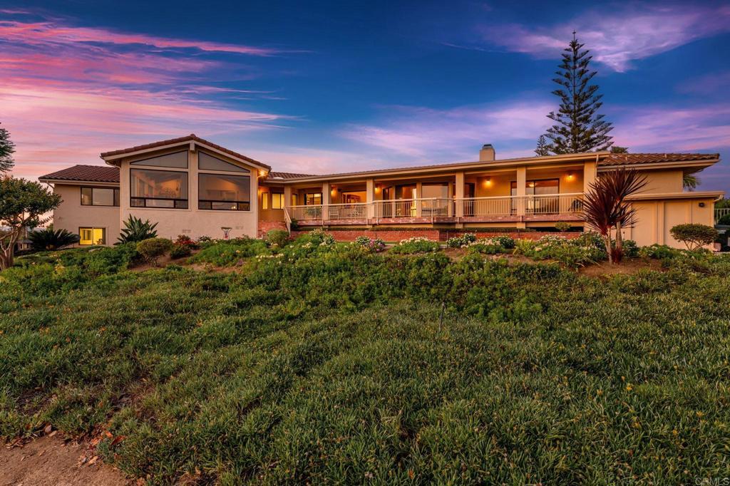 Perched at the Crest of Sunset Grove Rd. you will find this quality custom built gated one level ranch style home with so much charm and character. Never before on the market, the pride of ownership, maintenance and care will be evident throughout the home and the property. Truly breathtaking and inspiring panoramic views everywhere you choose to look. Enjoy the sunroom with walls of windows to frame the views and sunsets. The convenient corner lot location and fully usable 2.45 acre parcel allows access to the lower portion through a separate double gated entrance. Car lovers will enjoy the additional detached large 3 car garage for display of their garage art or for use as a hobby room. Zoned for horses and plenty of open area to add whatever your heart desires. The uncompromising quality along with the panoramic views and soothing ocean breeze create a trifecta of desires seldom found in one property. Schedule your tour today.