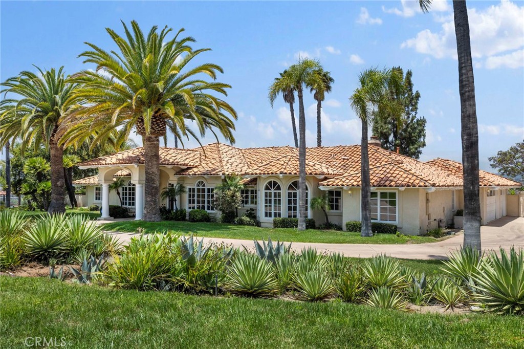 Unbelievable Opportunity!
"Your Sanctuary Awaits" — Elegant Mediterranean Estate on a Private Hilltop Oasis with Ocean Breezes Where Nature Meets Luxury
Experience Southern California living at its finest in this exquisite 3-bedroom + office (optional 4th bedroom), 3.5-bathroom home, located in the prestigious gated community of Lake Vista Estates. Nestled on a private 2-acre lot, this property features exceptional landscaping, including numerous palm trees, a serene fish pond, and a variety of fruit trees, all with panoramic views of the rolling foothills and the world-class San Luis Rey Downs Equestrian Facility.
From the circular driveway, a grand double-door entrance welcomes you with stately columns and lush palms, leading into a light-filled home with high ceilings, arched architecture, and large bay windows throughout.
The gourmet kitchen boasts a spacious center island, abundant cabinetry, and a stunning circular breakfast nook with a chandelier and vaulted ceiling. The expansive family room features a fireplace, wet bar, and three sets of French doors opening to a peaceful backyard oasis—complete with mature landscaping, a cascading fish pond, and breathtaking views.
The open floor plan is perfect for hosting guests or enjoying tranquil mornings. The luxurious primary suite includes dual cedar-lined walk-in closets with custom organizers, a spa-style bathroom with a soaking tub, separate shower, dual vanities, and peaceful garden views.
Located just minutes from the Pacific Ocean and within easy reach of Temecula wine country, Murrieta Hot Springs, Carlsbad Premium Outlets, and popular San Diego attractions such as the Safari Park and LEGOLAND. Convenient access to Hwy 76 and I-15, top-rated schools, hospitals, shopping, and dining.
This is more than a home—it's a lifestyle.
Come and experience it for yourself!
