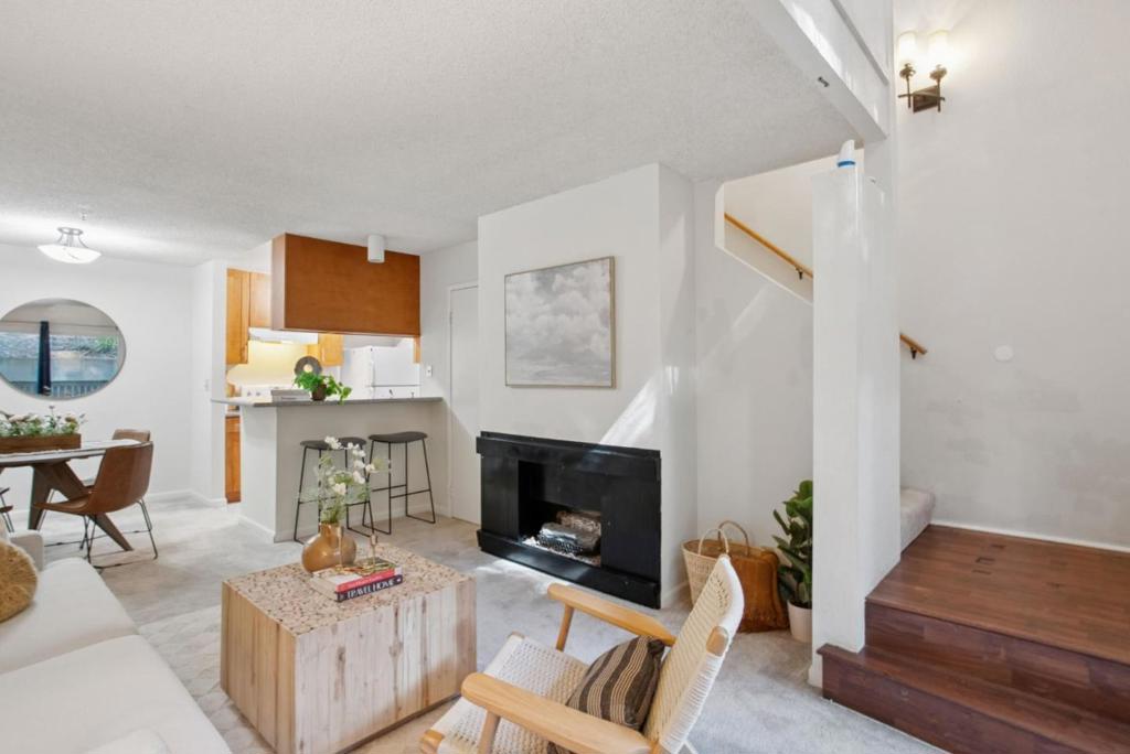 Experience townhouse-style living in this charming 1-bedroom, 1-bathroom condo with its own private entrance and direct unit access. The open-concept layout features a cozy fireplace, in-unit laundry, and a serene outdoor patio perfect for relaxing or entertaining. Quiet and private, this home offers a peaceful retreat in the heart of Daly City. Included is one deeded parking space and access to Crown Colonys resort-style amenities including 24/7 gated security, a fully equipped fitness center, swimming pools, hot tub, sauna, tennis courts, and a clubhouse. The HOA covers water, garbage, building insurance, and exterior maintenance for added peace of mind. Ideally located just minutes from BART, major freeways, shopping, and dining, this property combines comfort, convenience, and value an excellent opportunity for first-time buyers, downsizers, or savvy investors.