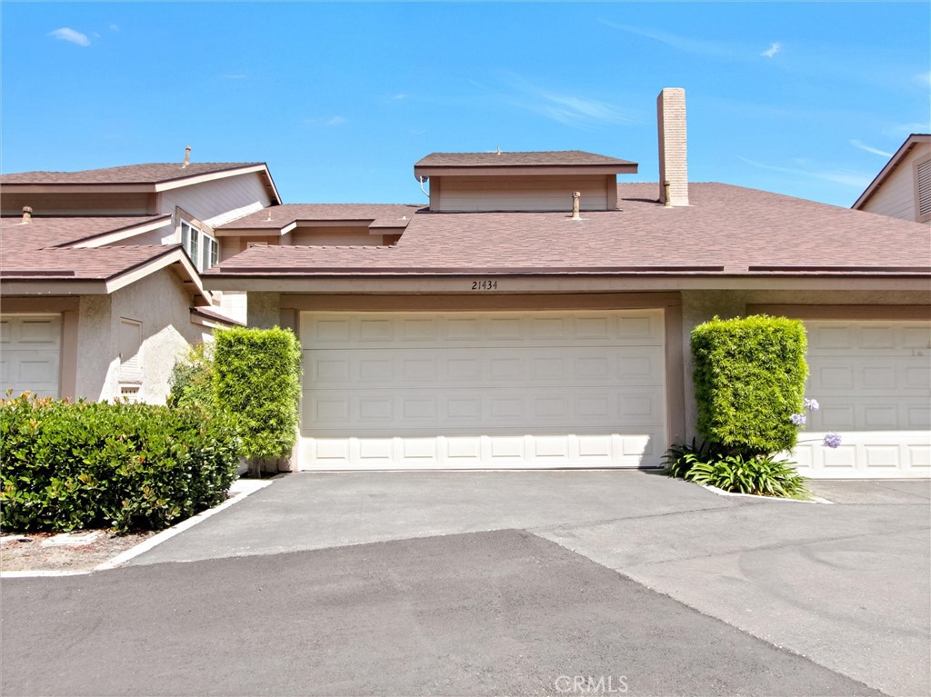 First time on the market in over 40 years! This exceptionally maintained townhome features 3 bedrooms and 2.5 baths with an open floorplan that's perfect for today's lifestyle. The property is located in a peaceful community of just 122 homes right in the heart of Lake Forest, nestled in a private corner of the neighborhood, just steps away from the community pool, spa, and recreation area. A private gated courtyard entry welcomes you into the home. As you enter, the kitchen and casual dining area are off to the right. The kitchen has been upgraded with granite counters, custom solid cherry wood cabinetry, Grohe fixtures, and stainless-steel appliances. On the other side of the kitchen is a formal dining room, which leads to a spacious living/family room area. The family room features a cozy brick fireplace with a handmade wood mantle, custom built-in shelves, plantation shutters, and wood flooring throughout. Downstairs you will also find a separate half bath for guests, along with a spacious enclosed indoor laundry room, which leads directly to your 2-car attached garage. Enjoy evenings outdoors in your private and spacious back patio, enclosed with vinyl fencing and custom hardscape. As you walk upstairs to the 2nd level, you will notice custom-built wooden stairs and handrails. The two secondary bedrooms are located on one side of the hall, along with the full bathroom which has been upgraded with custom tile and glass shower door. The spacious principal suite is located on the other side of the hallway, which features an upgraded bathroom and walk-in closet. Other features of this beautiful home include a whole-house fan, all newer Renaissance windows and solid mahogany leaded glass front and beveled glass patio doors, recently-upgraded PEX piping throughout, newly-installed A/C and water heater, and a custom-built cedar lined window seat for storage in the upstairs hallway. This home has been well cared for and it shows!