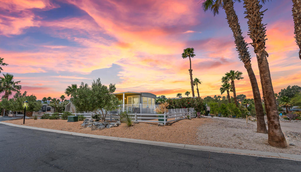 Welcome to Space 69 at The Sands RV & Golf Resort -- a beautifully maintained and upgraded park model on a rare corner lot with privacy, charm, and stunning mountain views. Step inside to a bright and inviting layout that blends comfort and functionality. The open living room flows seamlessly into a remodeled kitchen with clean finishes and plenty of cabinetry. Natural light fills the home, creating a warm, welcoming atmosphere throughout. The home features a spacious bedroom with mirrored closet doors and additional built-in storage, plus a flex room that can be used as a guest room, office, or bonus lounge. The in-unit full size laundry adds convenience for everyday living. Outside, enjoy your morning coffee or entertain friends on the large covered front deck, surrounded by desert landscaping and mature palms. A separate exterior storage shed adds even more room for your belongings. Located in The Sands -- a 55+ gated community with a 9-hole golf course, driving range, heated pool, pickleball, clubhouse, and more -- you're just minutes from the I-10 freeway and Palm Springs, offering easy access to dining, shopping, and outdoor adventure. Don't miss your chance to own one of the most desirable homes in the park.