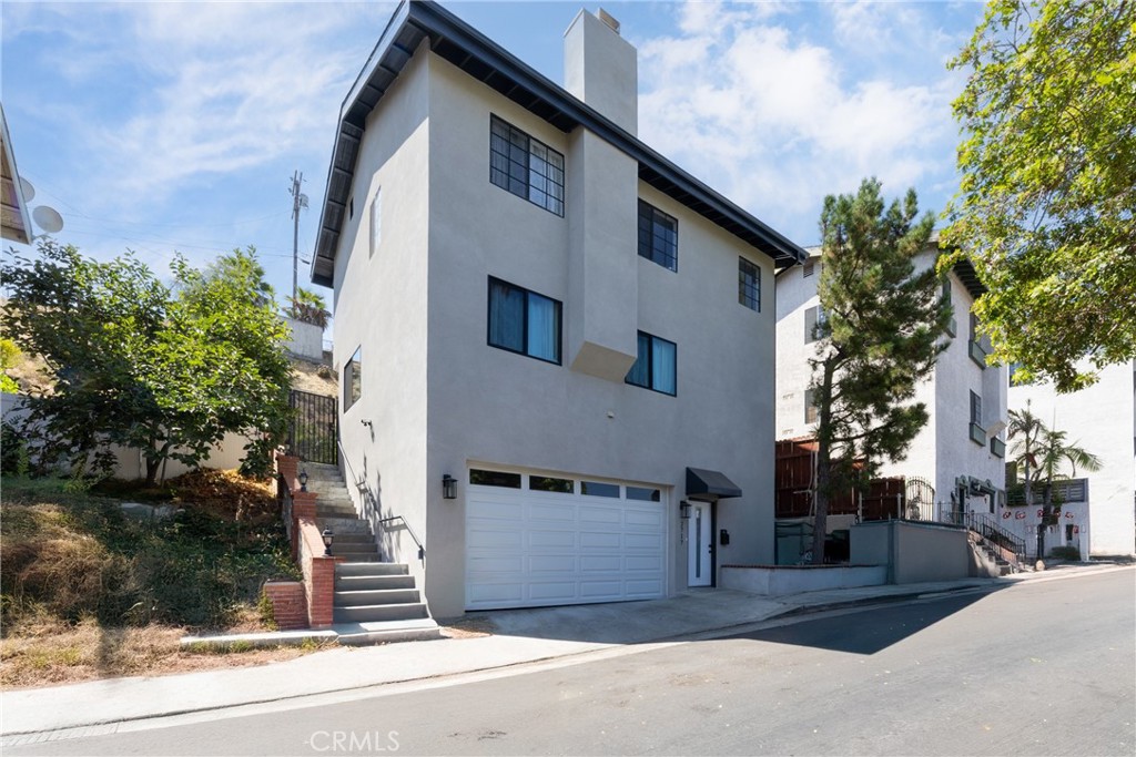 Wake up to breathtaking panoramic views of the San Gabriel Mountains, sip your morning coffee surrounded by lush greenery, and enjoy the perfect balance of tranquility and city convenience. Just minutes from the vibrant energy of Los Angeles. Welcome to your dream home in the heart of El Sereno! This beautiful renovated 2-story home features 3 bedrooms, 3 bathrooms, and 1,410 sq. ft. of comfortable living space on a 4,601 sq. ft. hillside lot, one of the most desirable yards in the neighborhood, with fruit trees like Tangerines and Persimmon. Whether you're hosting a moonlit dinner under the stars or a lively weekend BBQ with family and friends, the backyard is designed for unforgettable gatherings. Recent upgrades include a brand-new garage door, new laminate and carpet flooring, an updated kitchen with granite countertops and stainless steel appliances, fresh interior and exterior paint, new A/C unit and furnace and new windows throughout. Modern comfort, scenic beauty, and city access all come together here, ready for you to move in and make it your own.