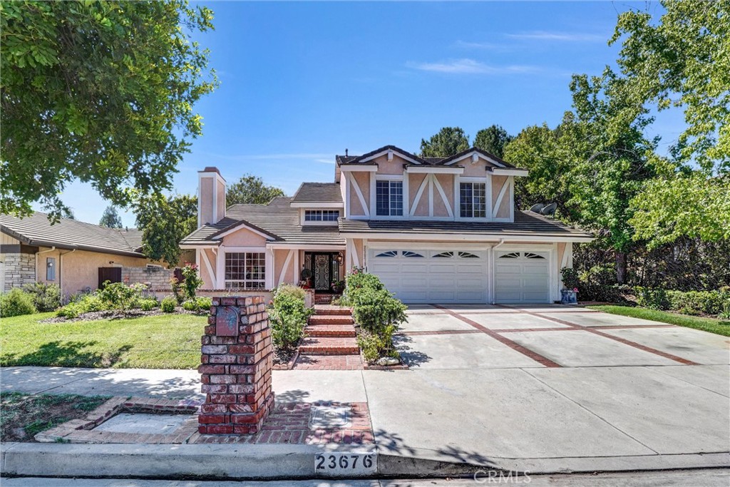 Renovated with an ideal floor plan in the sought-after area of West Hills. This stunningly updated home features 5 bedrooms and 3 bathrooms, covering more than 3000 square feet. The expansive driveway is equipped with brand new garage doors and freshly landscaped greenery. A custom wrought iron entry door with smoked glass greets you upon arrival. The formal entryway is embellished with magnificent grand Italian chandeliers. The formal dining room seamlessly connects to the living room, which includes a cozy fireplace. Revel in the two-story ceilings adorned with windows that provide breathtaking views. The kitchen has been beautifully remodeled, showcasing high-end cabinets and Thermador appliances, including a built-in refrigerator, a 6-burner stove, and a hood. It also boasts a large island and a dining area with views of the secluded backyard and pool. The open floor plan allows for a smooth transition from the kitchen to the family room, which features an additional fireplace and outdoor entertaining space. The backyard is a true California living, complete with a fully equipped outdoor kitchen that includes a BBQ, stovetop, dishwasher, refrigerator, and sink, along with a covered patio. There is also an extra outdoor dining area, all set in a private, resort-like backyard perfect for entertaining. The pool and jacuzzi have been updated with pebble stone resurfacing and feature a newer pool heater. The downstairs area includes a bedroom, a laundry room fitted with a washer and dryer, and a remodeled bathroom with a shower. Upstairs, you will discover a master bedroom with a seating area, bay windows overlooking the backyard, a spacious walk-in closet, and a large bathroom featuring a steam shower and separate tub, along with a sitting area and a double vanity. Additionally, there are 3 generous bedrooms and another remodeled bathroom. This residence is located on a tranquil cul-de-sac within an award-winning school district.