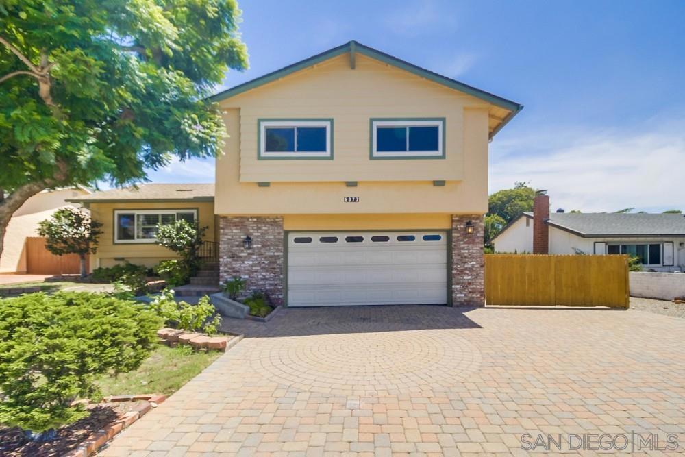 It's not just a home, it's a lifestyle at its finest! Highly sought after split level San Carlos 3 bedroom/ 2.5 bath home nestled privately and elegantly on lush green lot! Incredible custom brick driveway, mature trees, and formal entry greet you! To your left fall in love with the large living room with pristine engineered wood floors and oversized front window with plantation shutters! Living room flows to big dining area with lovely views of the fabulous backyard! Dining area opens to light and bright kitchen with double ovens, stone counter tops, lots of cabinet and counter space, and breakfast bar seating for more casual meals! Spacious family room with cozy fireplace for cooler evening, bar area with utility sink, guest powder room, and slider out to backyard! (Can even be bedroom #4)! Large primary suite with loads of beautiful natural light, en-suite bath, and large custom walk-in closet! Nicely sized additional bedrooms too! Incredibly quiet and private backyard with big covered wood patio/deck and plenty of room for entertaining, kid play, and pets! Details not to miss-RV parking, central heating and air, 2 car garage, solar, storage shed, and more! Walking distance to area schools and parks. Make this YOUR home before someone else does! Welcome Home!