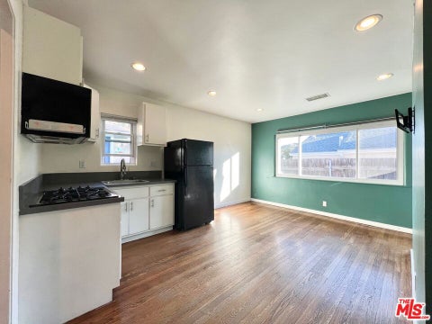 Photo of 10006 Silverton Avenue, Los Angeles, CA 91042 (MLS # 26860963)
