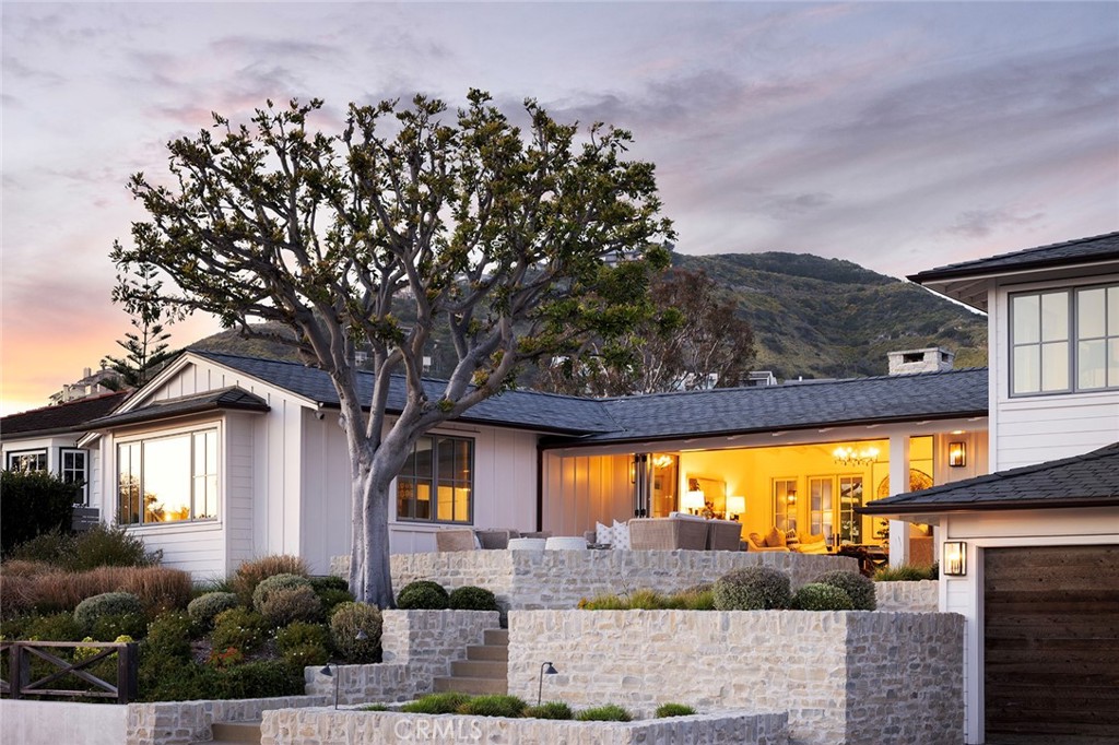 Experience coastal living at its finest in this meticulously crafted Coastal Contemporary custom home nestled within the prestigious enclave of Three Arch Bay, Laguna Beach. This single-story residence spans 3,770SF of luxurious living space, boasting four master bedroom suites designed for utmost comfort and relaxation.
While blending modern elegance but prioritizing health, this home is a masterpiece of sustainable architecture, constructed to LEED Platinum building standards, with oversight by the renowned Healthy Home Biologist. Utilizing all organic and natural materials, it offers a sanctuary of health and wellness. Situated on a sprawling 9,000SF corner lot at the convergence of two quaint roads, the residence offers unparalleled privacy and tranquility with commanding elevated ocean views, mere steps away from the private shoreline.
Every detail of this residence has been thoughtfully curated to offer a harmonious blend of luxury, environmental & health consciousness, including an upgraded HVAC system by "Beyond Guardian" Air purification and Hepa-Filtration suite built-in, Low EMF build with all electrical systems encased in metal conduits ensuring minimal electromagnetic field exposure, whole home water filtration, attic and crawlspace ventilation systems, whole home generator, Lacanche range for culinary enthusiasts, Du Chateau wide plank oak flooring, and stunning millwork accenting the walls and ceilings for timeless elegance.
Master-crafted for both aesthetic appeal and ecological sensitivity, the landscape architecture is a testament to sustainability, designed by Garden Studio and Dig Landscape. The seamless transitions of indoor-outdoor flow between living areas and the meticulously landscaped outdoors is flawless.
In short and simply put, this home is the epitome of coastal sophistication—where luxury, sustainability, and wellness converge to create an unparalleled retreat for the discerning health-conscious homeowner.