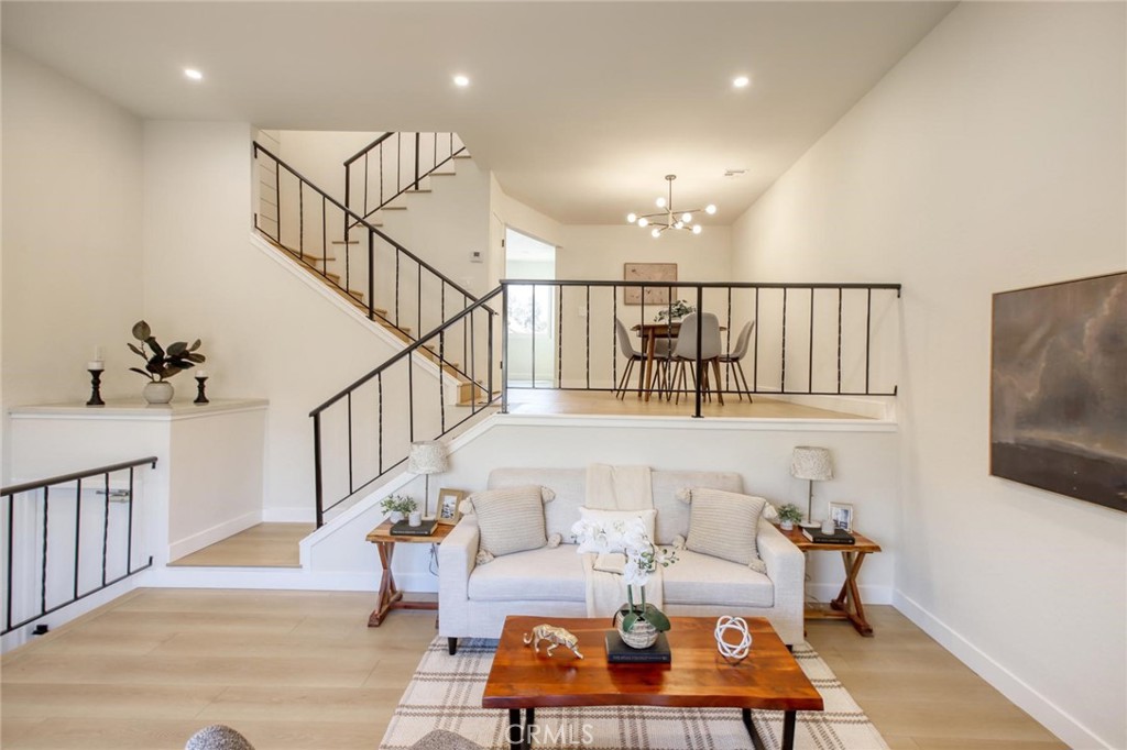 Welcome to this beautifully maintained multi-level townhome in the heart of Tujunga! Located in a quiet community, this spacious 2-bedroom, 2.5-bath unit features an open-concept living and dining area with a cozy fireplace, private balcony, and updated flooring throughout. The kitchen offers ample cabinet space and modern appliances, while upstairs you'll find generously sized bedrooms with plenty of natural light. Enjoy in-unit laundry, a private 2-car garage, and access to community amenities including a pool and spa. Just minutes from local shops, parks, top-rated schools, and historic Bolton Hall. A perfect blend of comfort, convenience, and charm!