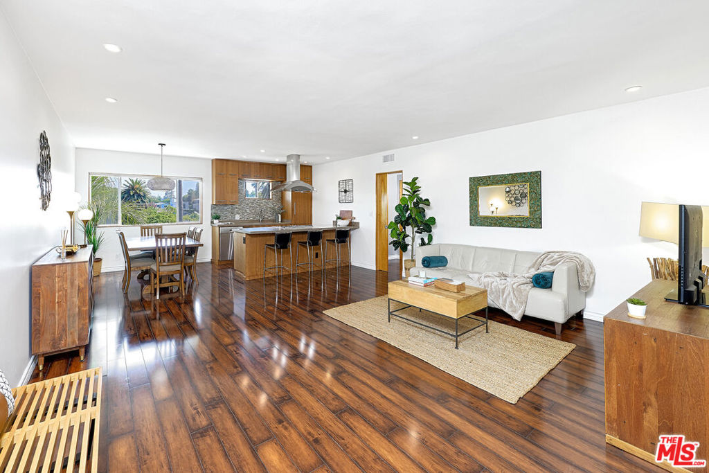 Top-Floor Stunner Just 4 Blocks from the Beach! Sun, style, and ocean air this bright and beautifully updated 2-bed, 2-bath corner unit delivers all three. Located on the top floor of a mid-century gem at 4th & Bay, this is the perfect Santa Monica retreat or chic pied-a-terre. Wake up to mountain views, catch ocean glimpses from your primary bedroom, and stroll to Main Street for coffee, brunch, or sunset cocktails. Inside, enjoy wood floors, sleek renovated baths, in unit laundry, and a modern kitchen with high-end appliances ideal for whipping up finds from the local farmers market. Peaceful. Walkable. Effortlessly cool. This one checks all the boxes for stylish coastal living.